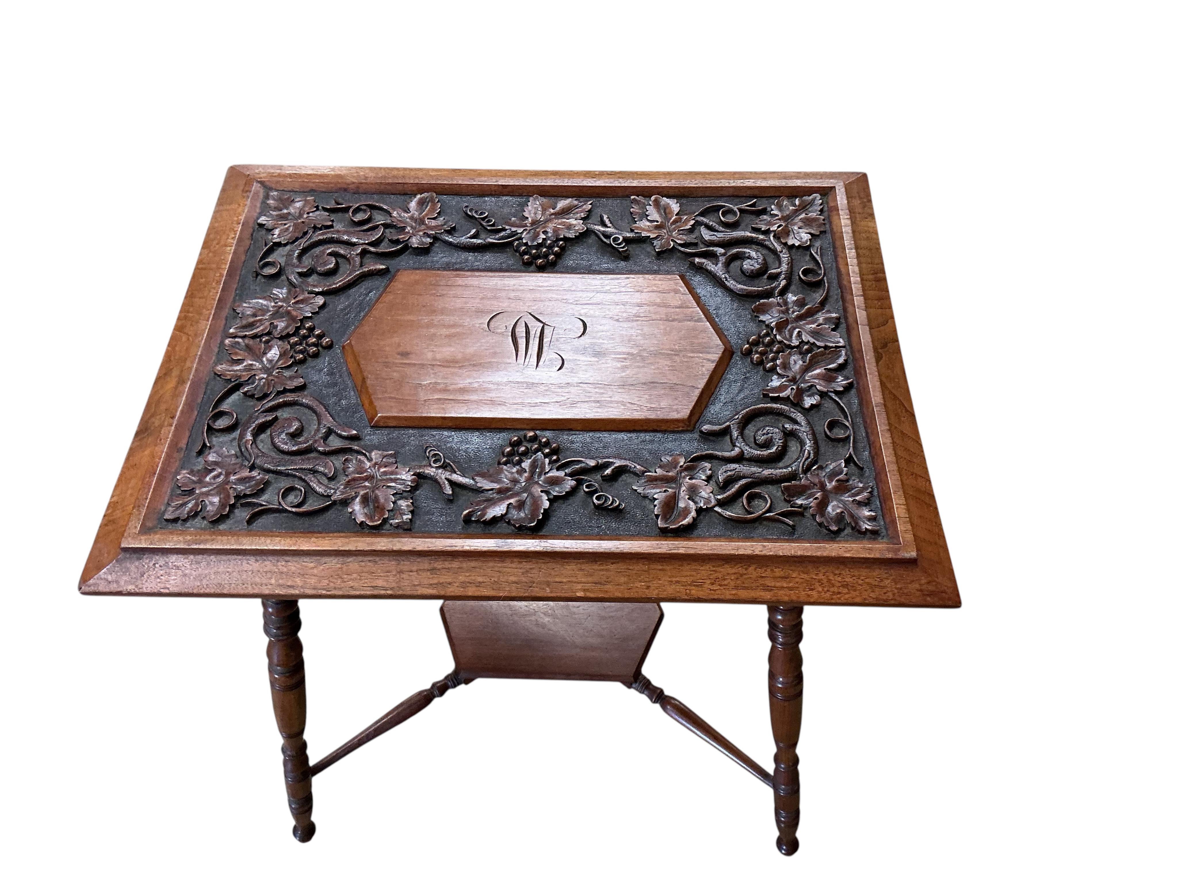 A late Victorian rectangular carved oak occasional table, decorated with vines, width 66cm, depth 49cm, height 67cm
